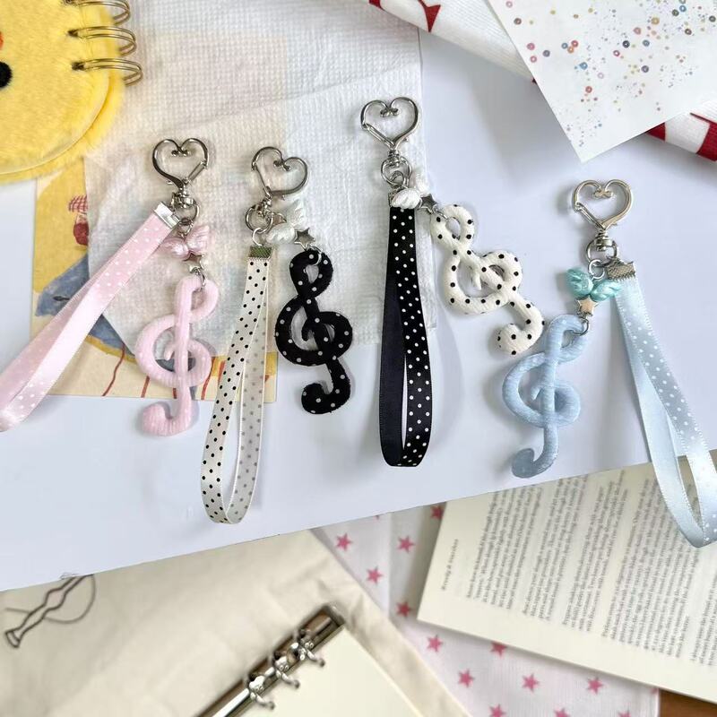 Artistic, vintage-style, sweet polka dot, striped, star, and musical note keychains, phone charms, and AirPods and bag accessories Artistic, vintage-style, sweet polka dot, striped, star, and musical note keychains, phone charms, and AirPods and bag accessories