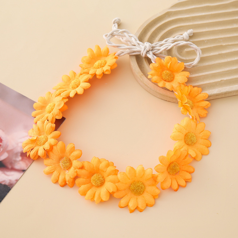 女性の女の子のヘアバンドは11輪の花の頭を編んで小さい太陽の花を持って旅行します。|undefined