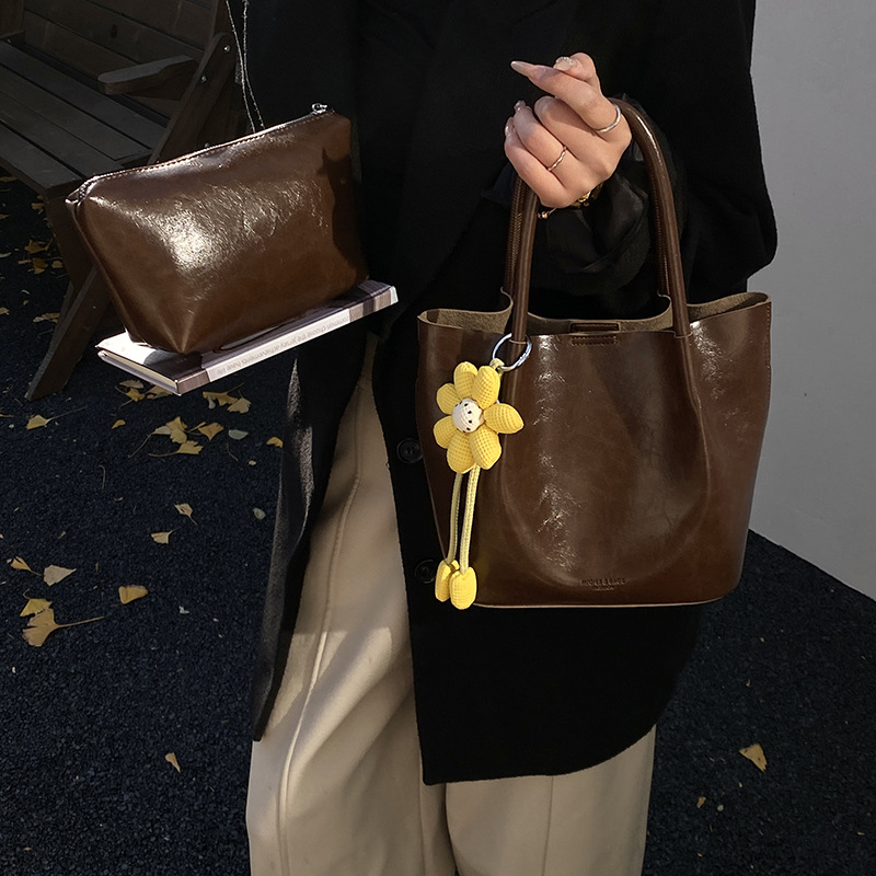 Nicho Zhong canasta de verduras de alto nivel, bolso de cubo, mujer 2025 nuevo retro bolso de trabajo, mochila de viaje