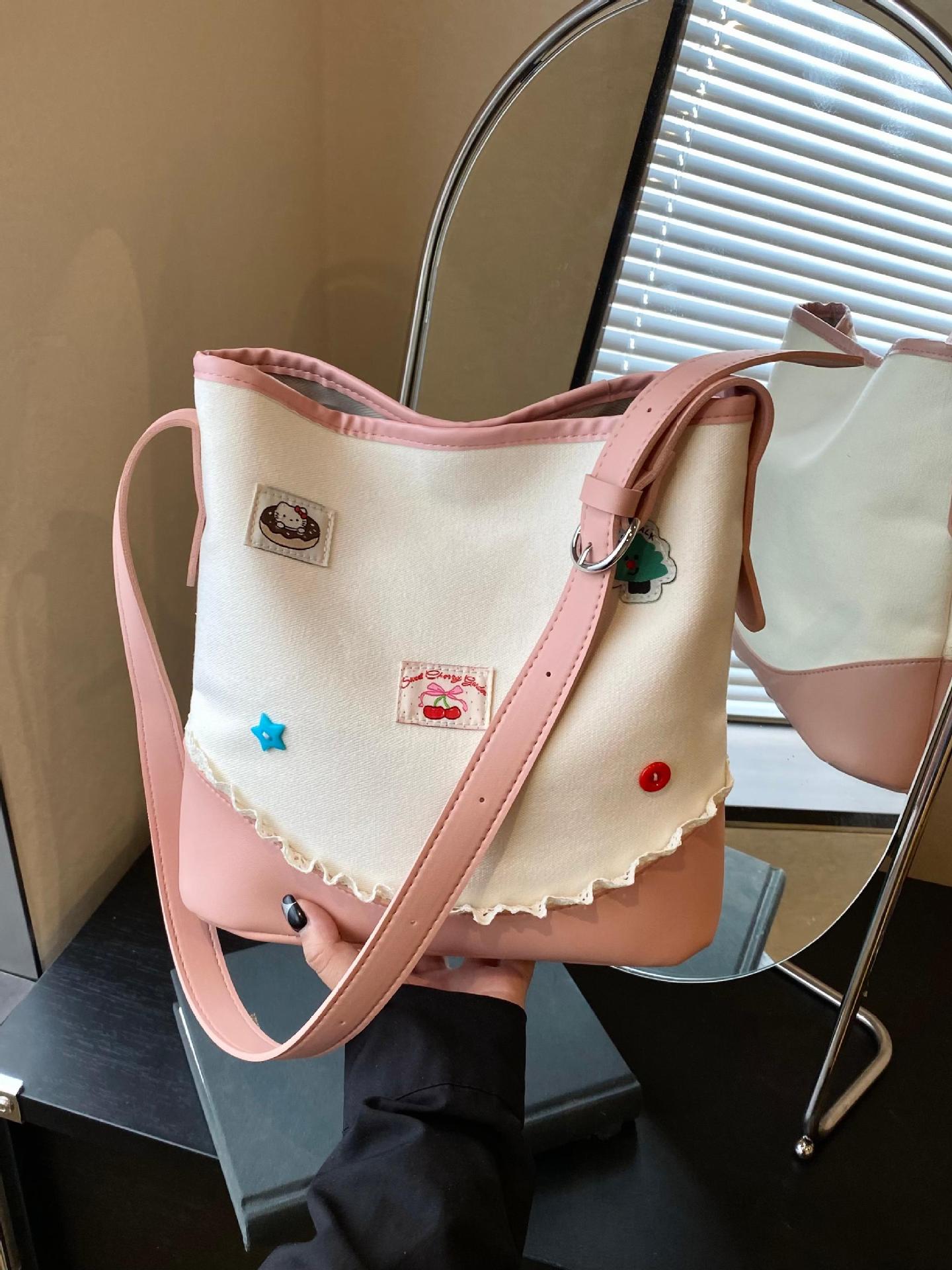 Bolso de cubo de ocio de color de contraste transfronterizo para mujer 2025 nuevo bolso de hombro de tendencia de moda salvaje bolso de mensajero de viaje de trabajo