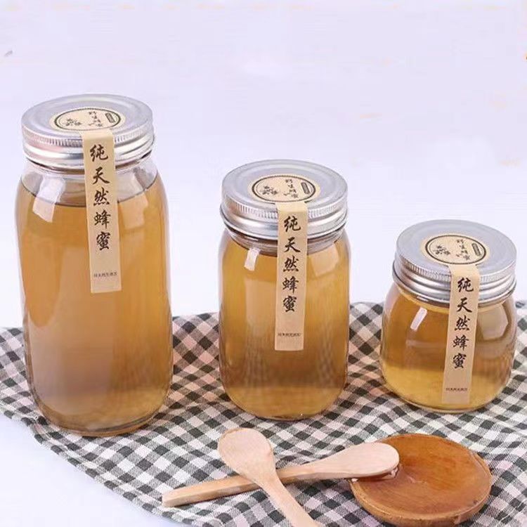 Botella de miel redonda de vidrio de grado alimenticio 1 kg de latas de sellado 2 kg de latas vacías con tapa a prueba de fugas gruesas