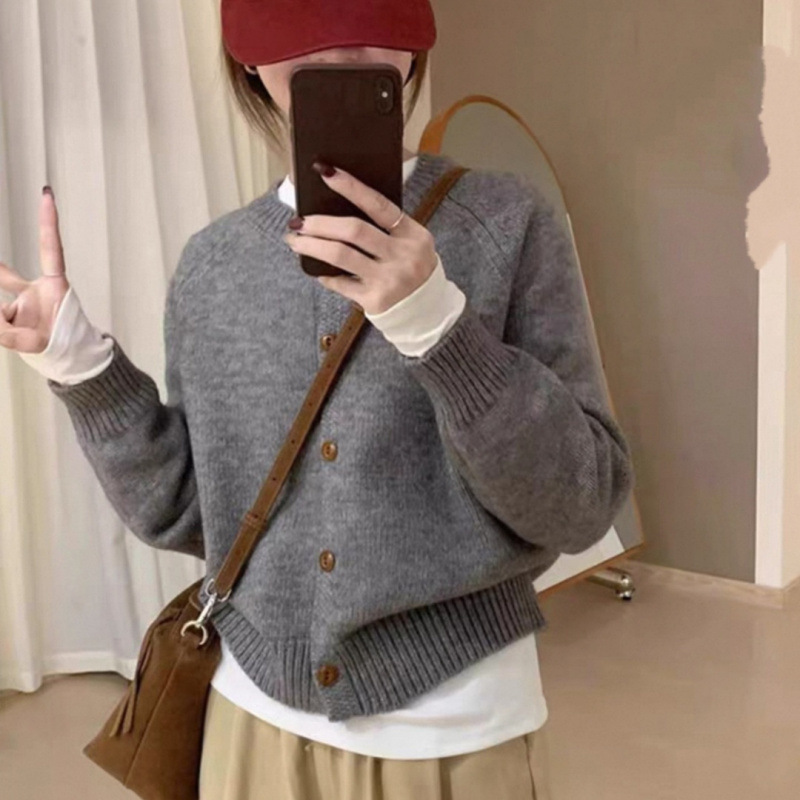 Corea del Sur 2025 otoño y invierno nuevo estilo extranjero V-cuello grueso aguja floja de color sólido jersey de punto suéter