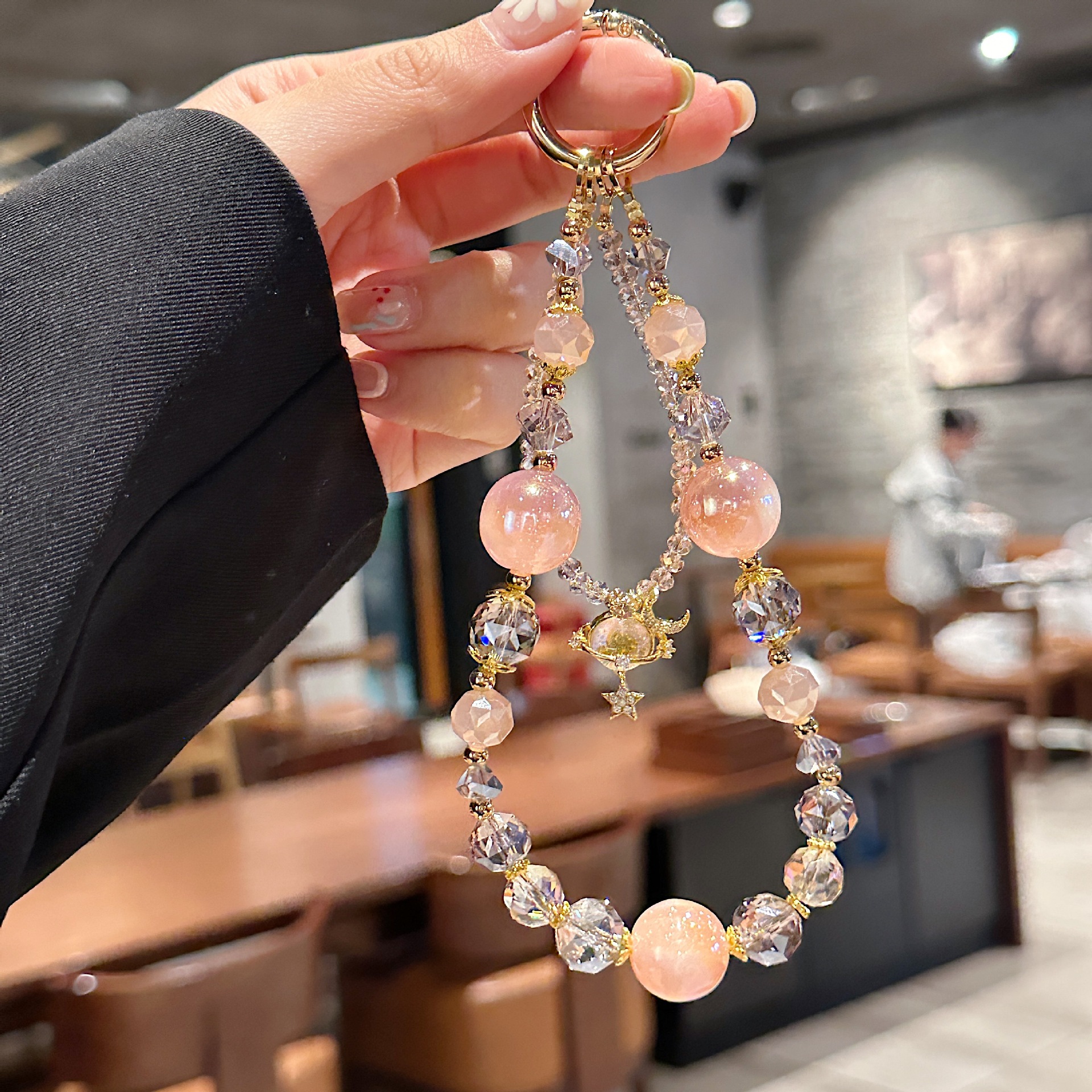 Boutique hecho a mano de alta gama para teléfono móvil cadena larga de vidrio de universo pequeño femenino cordón de teléfono móvil de moda colgante de mensajero largo