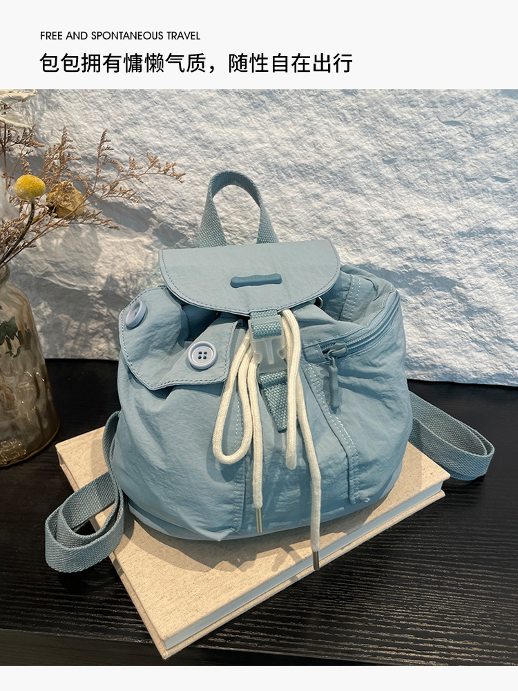 Colorful Fox's new Korean-style ins women's niche design lightweight pocket button drawstring backpack undefined