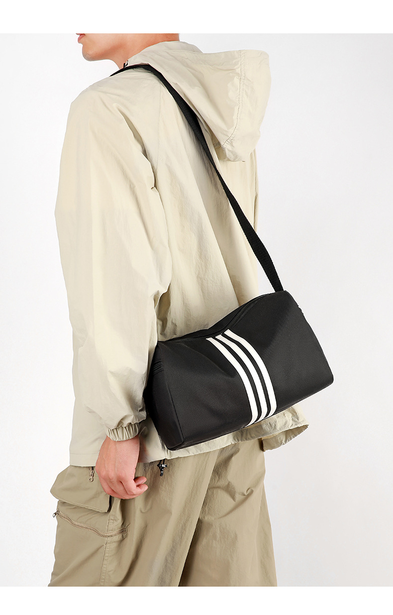 This is a simple, fashionable, casual and versatile crossbody bag for women, suitable for commuting. It is a large-capacity striped single-shoulder bag for both men and women undefined