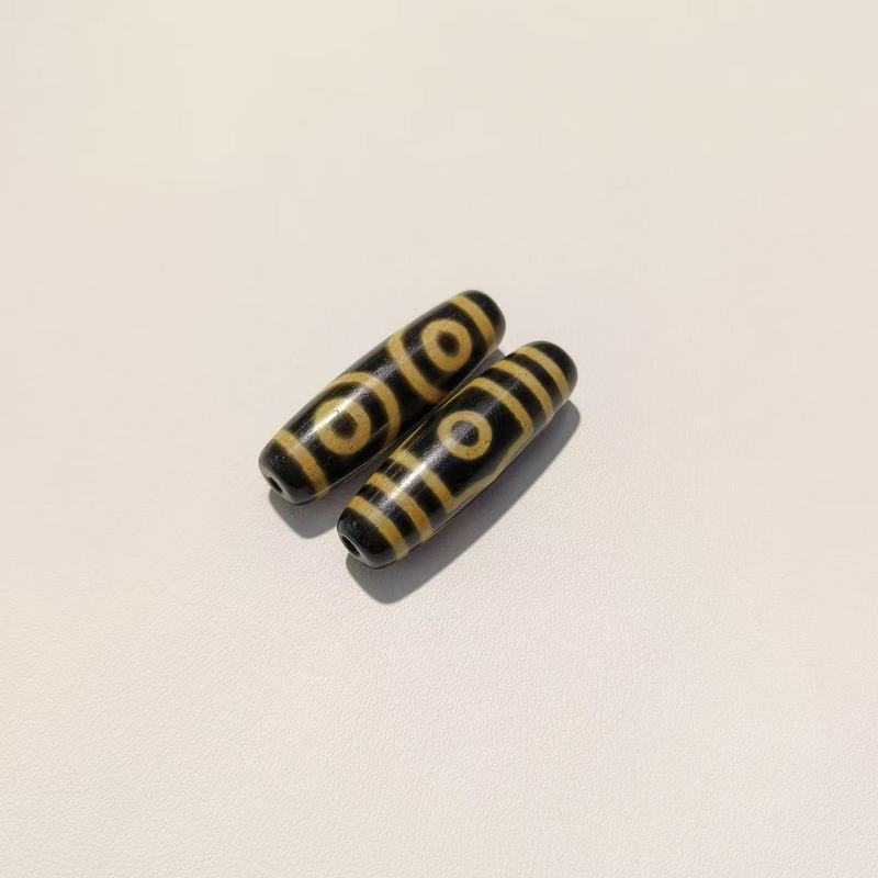 メーカー歯黄包糊九眼12 × 38mm天珠歯黄風化古法包糊瑪瑙天珠【a級】|undefined