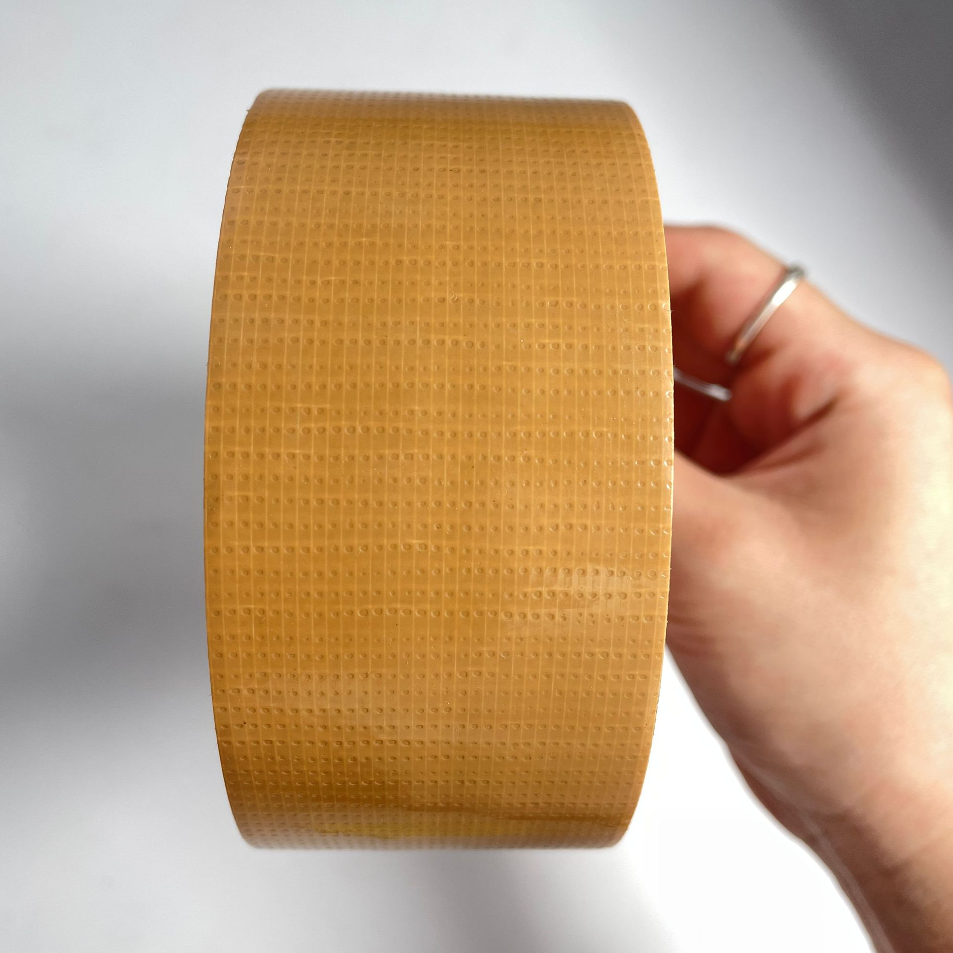 Tape adhesiva de tela de alta viscosidad decoración sin rastro película adhesiva de tela de malla adhesiva de tela unilateral cinta adhesiva de tela