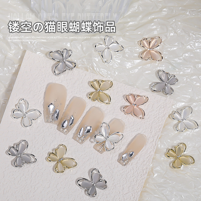 Uñas de cristal gato ojo mariposa aleación joyería en línea celebridad uñas hueco mariposa desgaste accesorios de uñas al por mayor