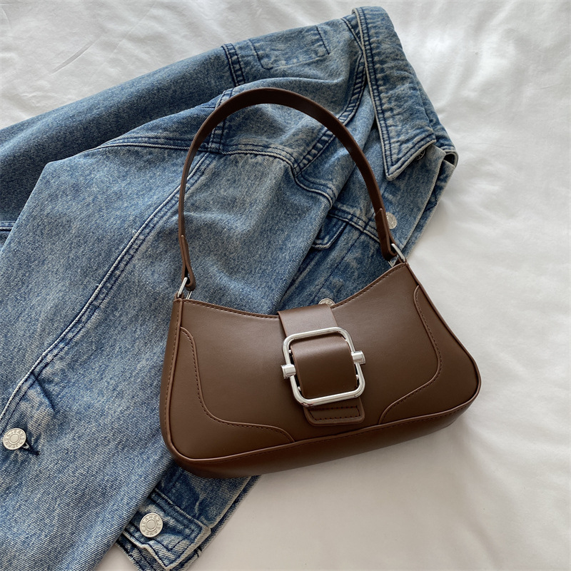 Versión coreana del bolso de axila de alta gama, popular de este año, bolso de palo francés de estilo occidental, diseño de nicho, bolso de hombro de temperamento de moda, viaje