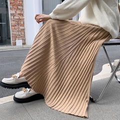 2024ファッションのロングスカートの半身のスカートのストライプのa字のプリーツのスカートのメリヤスの女性の秋冬の高い腰はやせている大きいスカートの子供を現します。