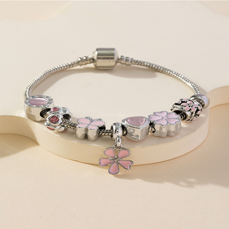 Panjia pulsera Dora DIY cuentas explosivas transfronterizas colgante pétalos de goteo de aceite ajustable flor amor pulsera de cobre