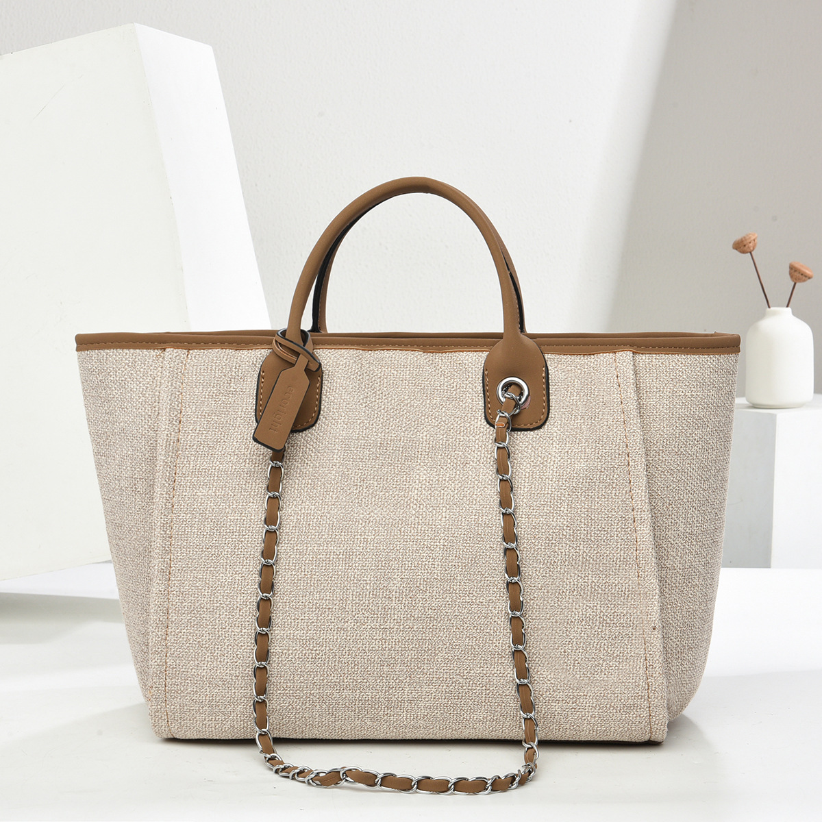 Bolso de mano de gran capacidad 2025 textura elegante bolso de mujer de color puro bolso de cubo con cadena bolsos transfronterizos