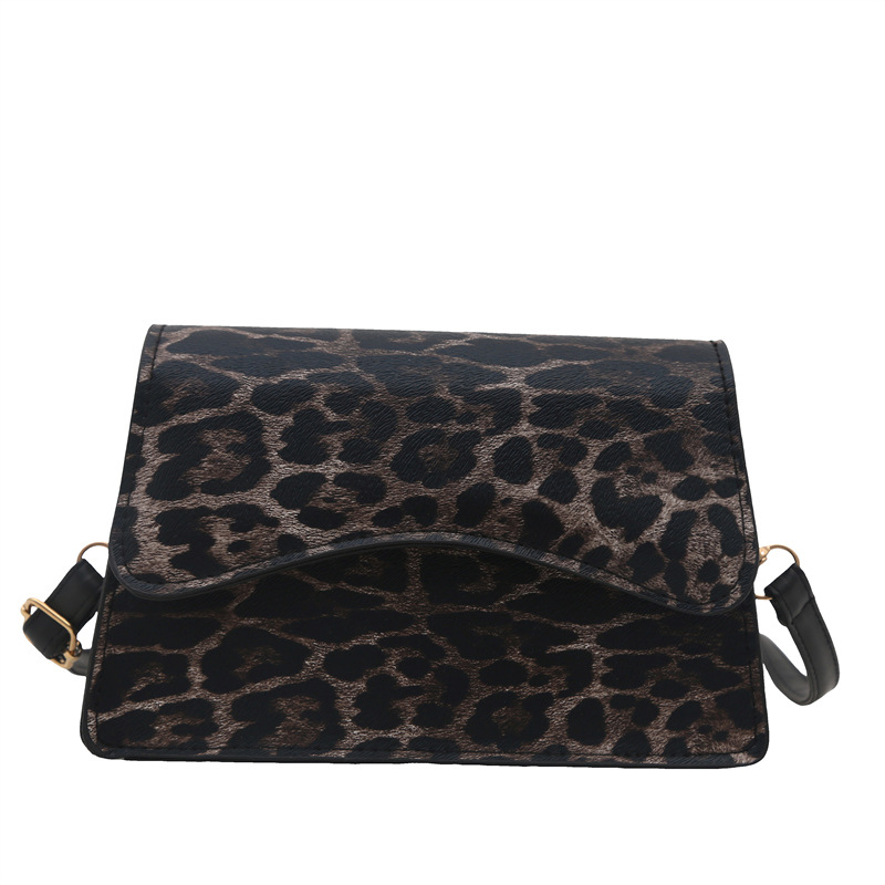 Bagos de brazo estampados de leopardo de estilo extranjero mujeres 2025 primavera de moda europea y americana retro viaje bolso de hombro bolso de forma pequeña