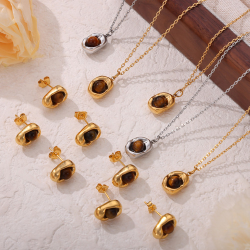 Vintage English-style niche accessory with an indented elliptical pendant featuring tiger's eye stone, designed titanium steel jewelry set