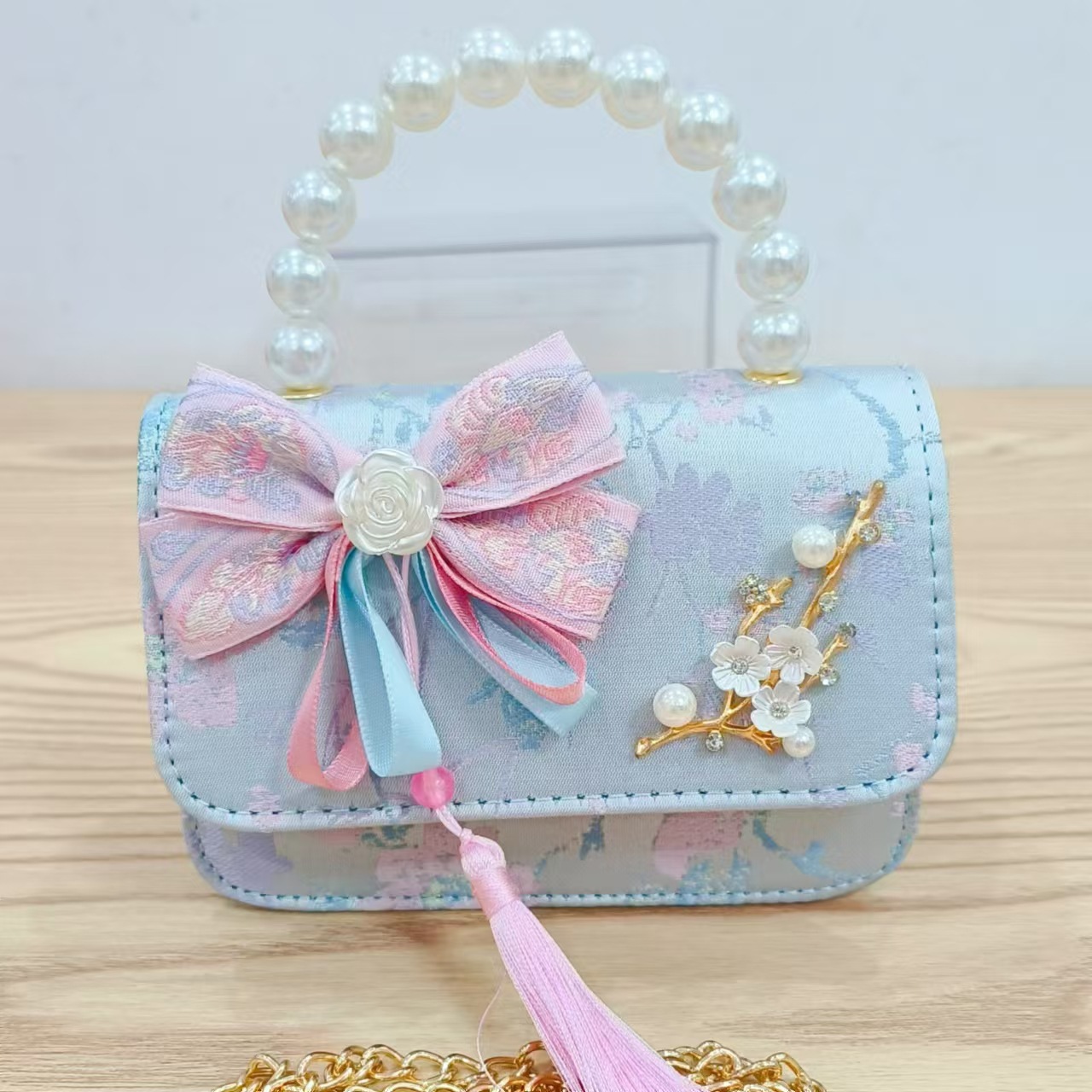 Bolsas de niños arco de estilo chino borda de niña pequeña princesa perla bolsa de cambio de mano al por mayor