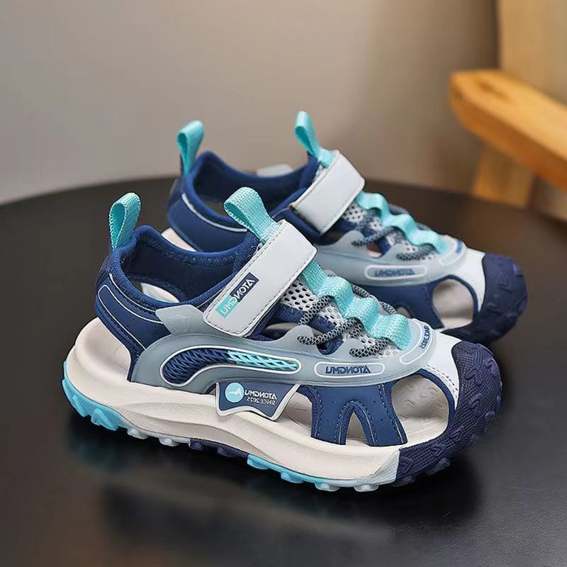Niños sandalias Baotou 2026 verano nuevo estilo de moda para niños zapatos de playa para niños zapatillas suaves zapatillas individuales