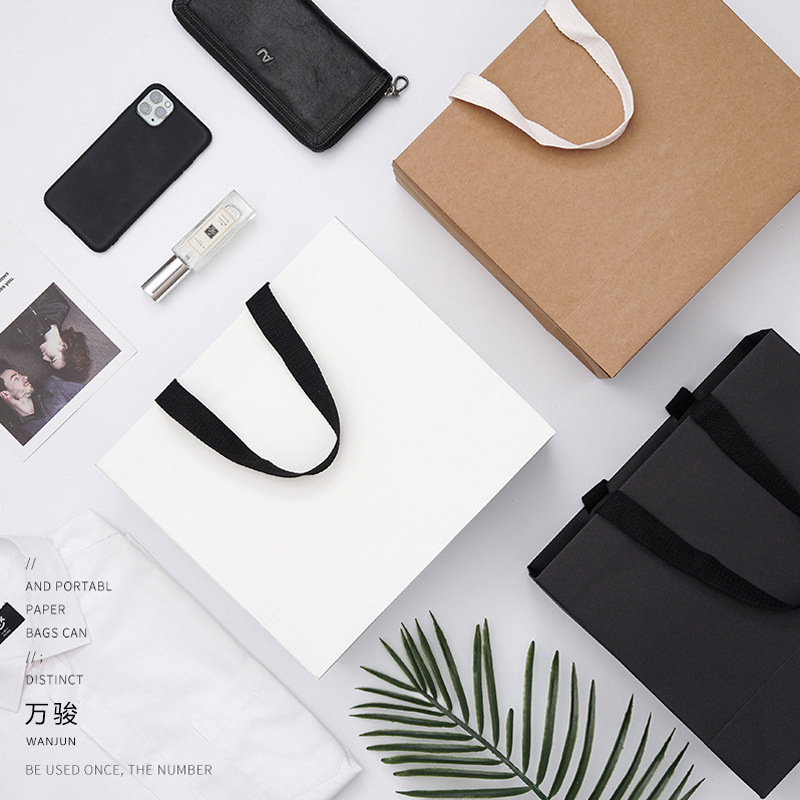 现货牛皮纸袋压纹外贸广告手提包装袋批发购物服装礼品袋彩印logo