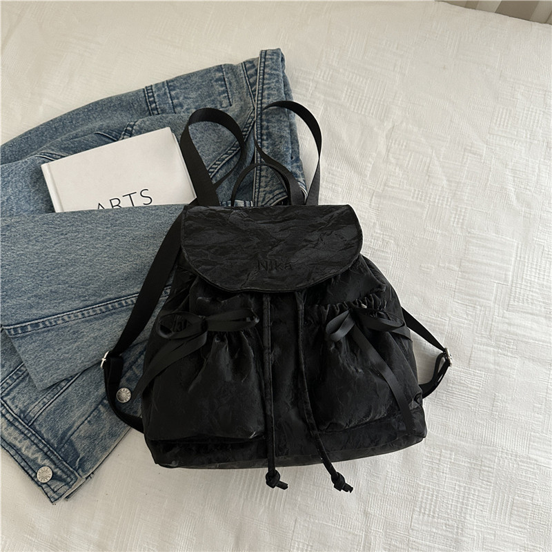 Mochila de lazo de sentido de alta gama para mujer 2025 nueva moda mochila de viaje mochila escolar casual para estudiantes coreanos