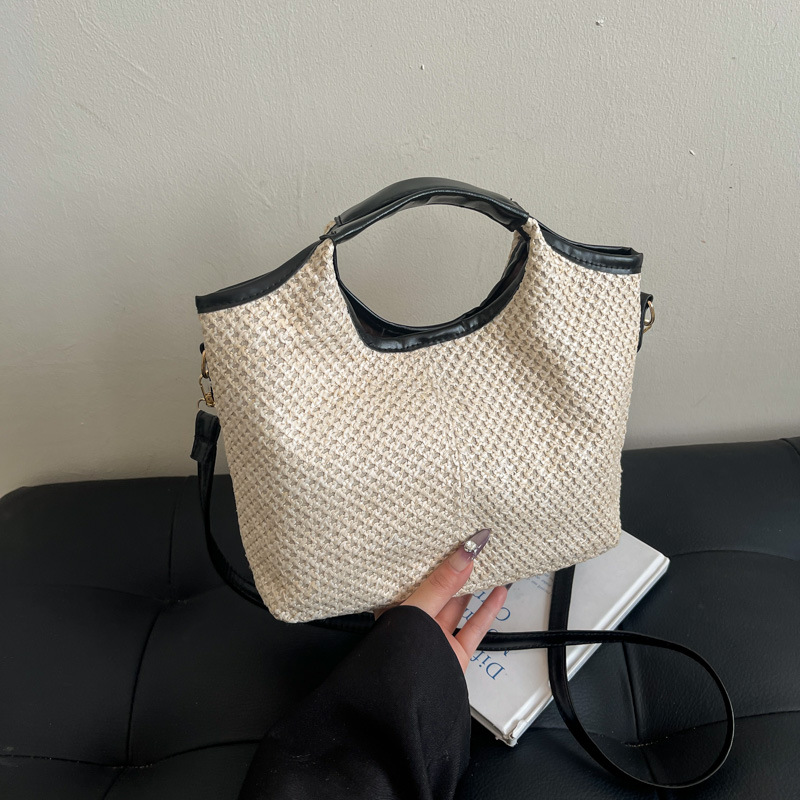 2025 este año popular bolsas de tejido de mano de mujer moda de estilo extranjero bolsa de hombro bolsa de viaje de playa bolsa de paja