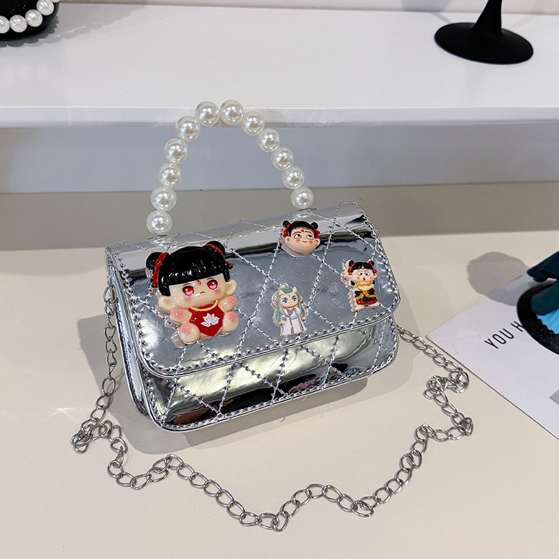 2025 nuevo niño pequeño viento mochila de hombro pequeña niña espejo princesa bolso de perla bolso de dibujos animados