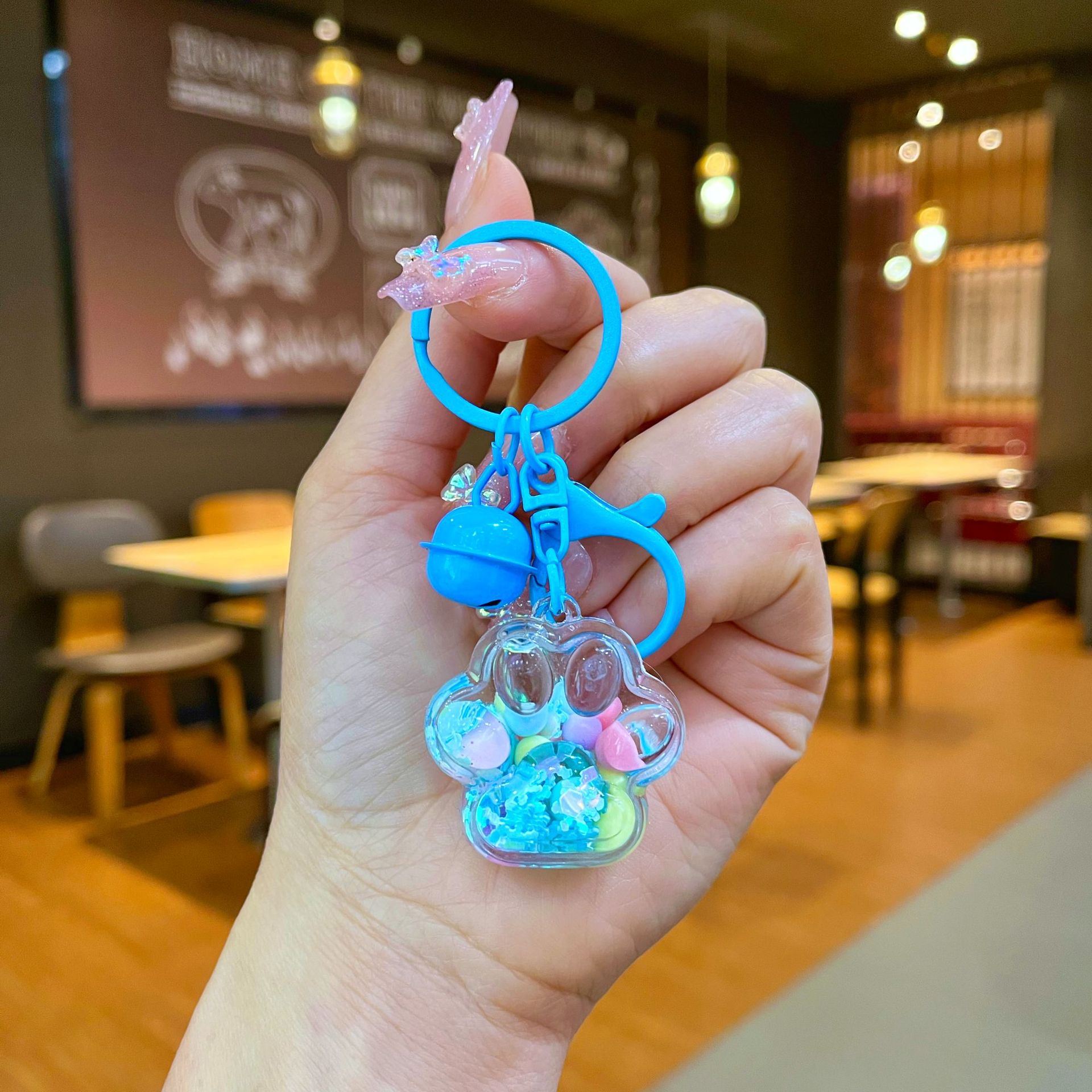 Aceite de gato garra arenas movedizas llavero lindo dibujos animados cadena colgante captura muñeca máquina agarrar pequeño regalo al por mayor