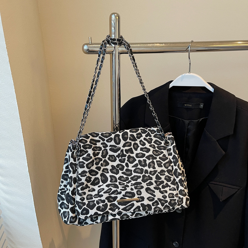 Bolsa de gran capacidad de tela de leopardo rojo, bolso de mujer 2024, nueva moda, textura de hombro, braza, mochila de estilo extranjero, mujer