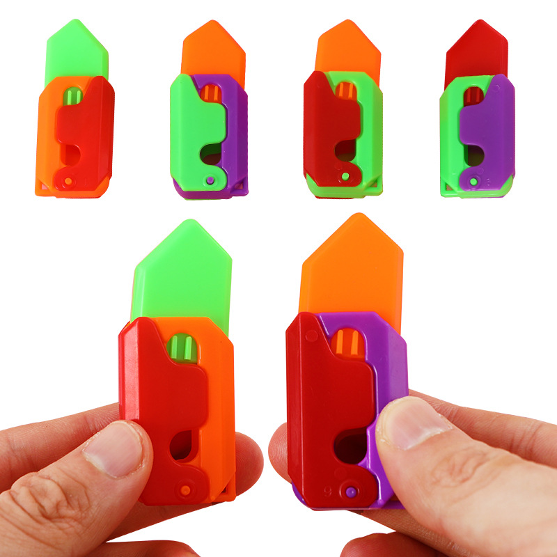 Cuchillo de gravedad 3D explosivo transfronterizo mini portátil de 6cm Cuchillo de zanahoria luminoso Cuchillo de zanahoria de juguete de descompresión