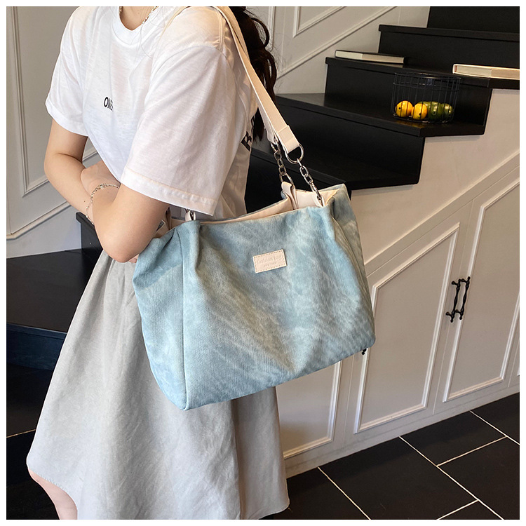 Korean style simple and versatile bag for women, new summer 2025 fashion and niche handbag, large capacity tote bag for commuting undefined