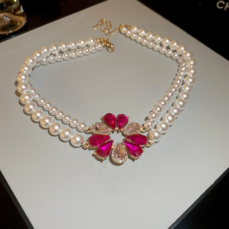 Aguja de plata diamante incrustado gota de agua flor perla pendientes collar traje francés retro nicho pendientes luz pendientes de moda de lujo