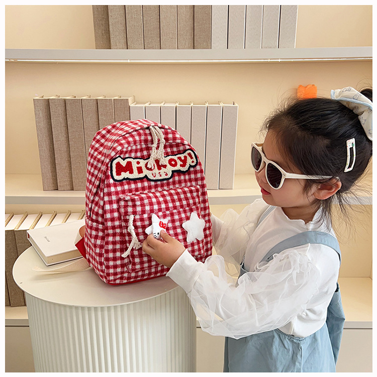 The large-capacity red woolen checkered backpack for primary and secondary school students is a unique and versatile choice. It's a trend for girls to carry backpacks during their leisure trips undefined