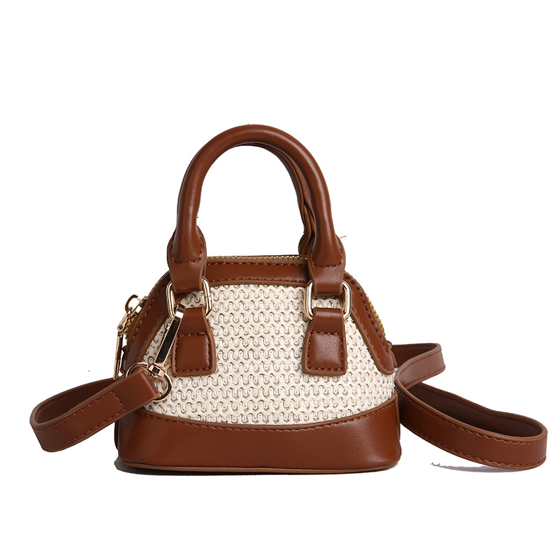 Bolso de hombro para niños y niñas de color de contraste de moda coreana, mini bolso de bebé tejido de paja de estilo occidental, nuevo bolso de mensajero para niños