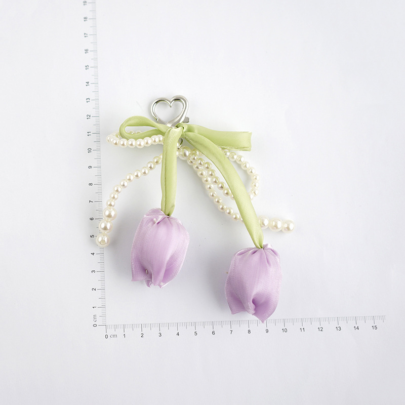 Venta caliente todo fósforo tulipán perla rosa serpentina arco púrpura colgante amor llavero bolso colgante