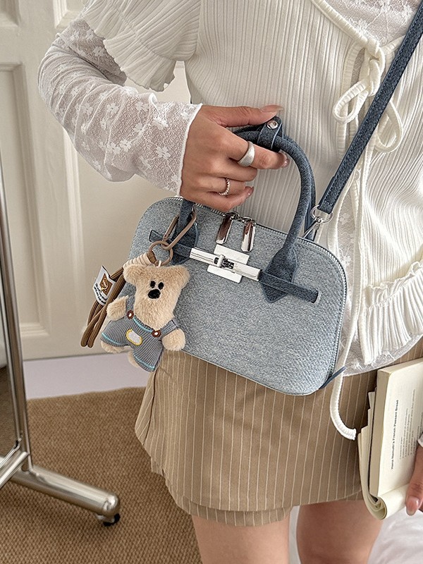 Bolsa de concha de nicho coreano para mujeres 2026 comercio exterior nuevo estilo de alta moda versátil mochila de hombro