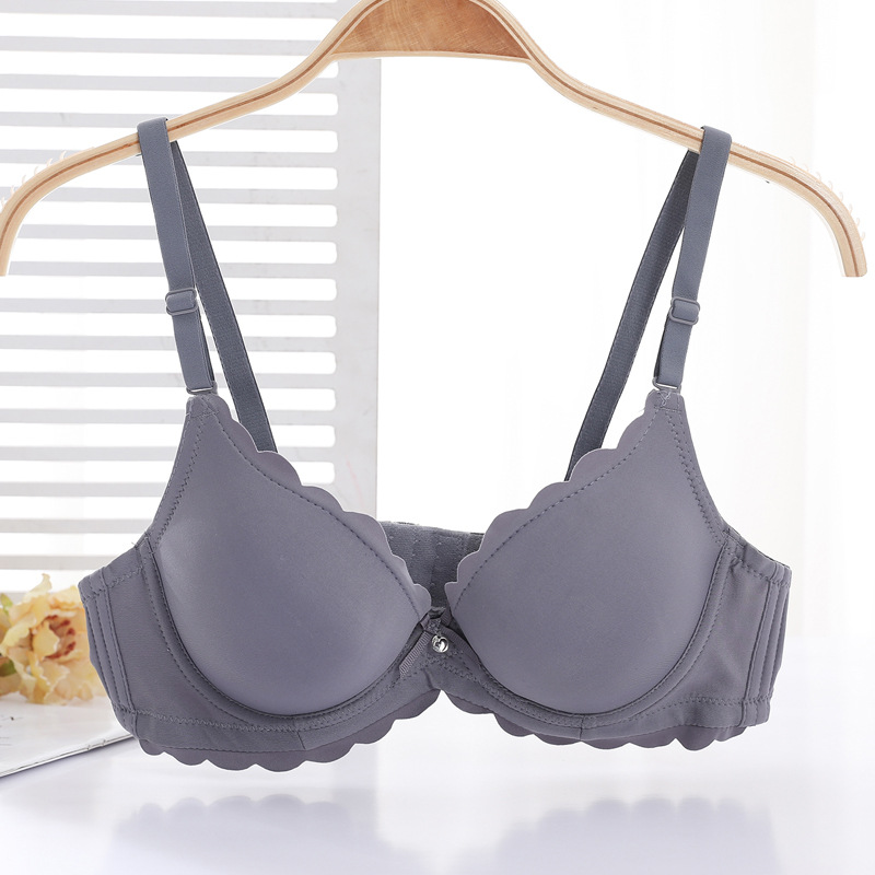 Fábrica de sujetadores de Shantou en stock brillante sin marcas de grosor pequeño sujetador de ropa interior para mujeres ajustable soporte superior para evitar caída