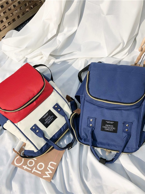 Estilo de gato transfronterizo de buena calidad, bolso de mamá de gran tamaño, mochila portátil, gran cantidad de stock, cremallera Oxford