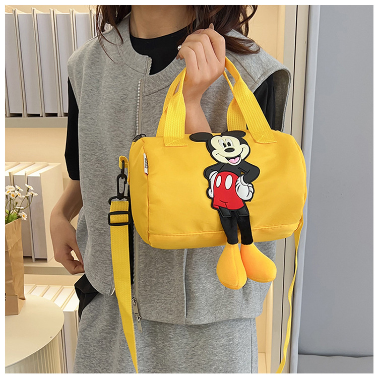 The 2021 new children's bags feature a cute Mickey Mouse pattern bowling bag for girls and a fashionable hand-held shoulder bag undefined