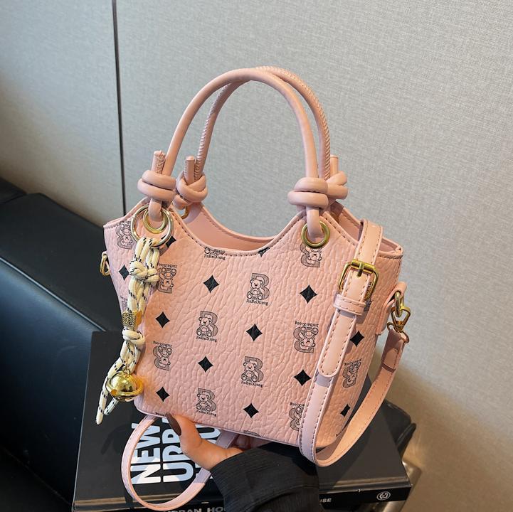 Tendencia impresa bolso de cubo de mano mujer 2025 nueva moda textura versátil bolso de hombro super caliente bolso de mochila