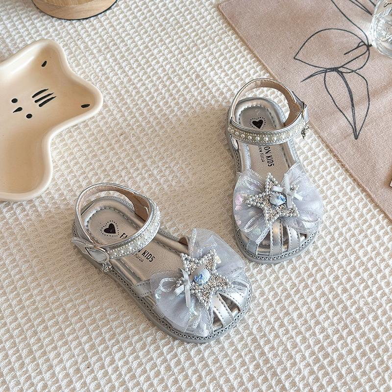 Niñas sandalias Baotou 2026 verano nuevo estilo de moda infantil sandalias versátiles diamante estrella malla princesa zapatos de moda