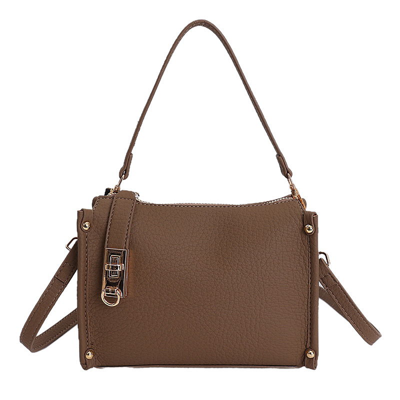Nicho Zhong textura bolso de mujer 2026 nuevo remaches de gran capacidad simple de hombro simple bolso de brazo de viaje