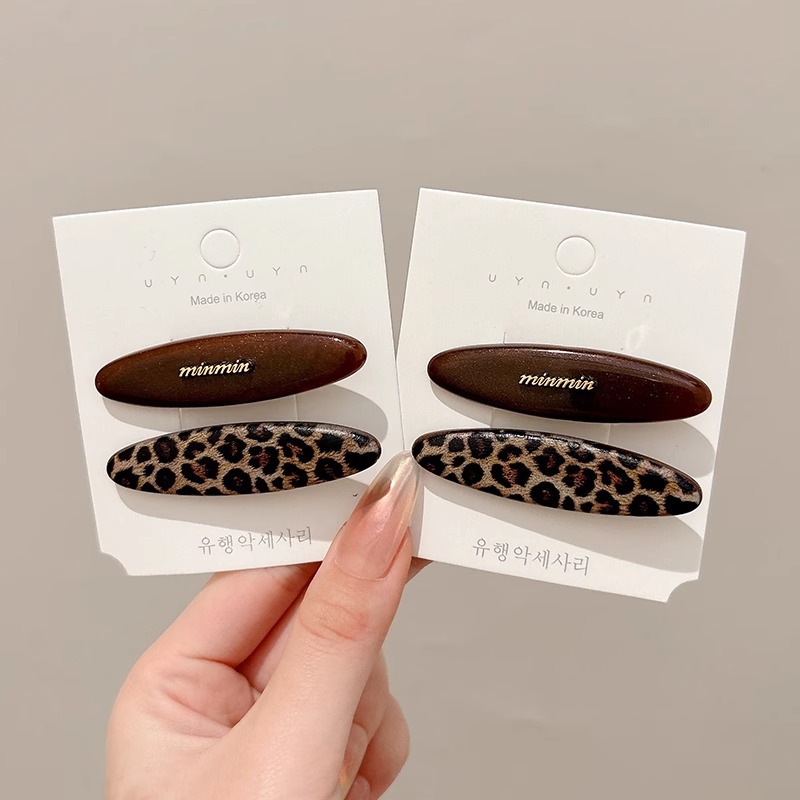 Temperamento acético cabello estriado lateral clip de cabello 2025 nuevo estilo retro puerto clip de boca de pato simple clip de cabello tocado