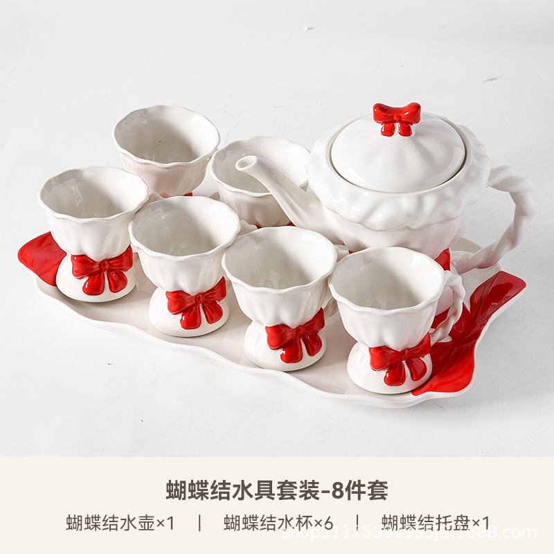Una olla de cerámica, cuatro tazas de juego de té, caja de regalo de inauguración de la casa, lazo pintado a mano, taza de té de la tarde, regalo de boda