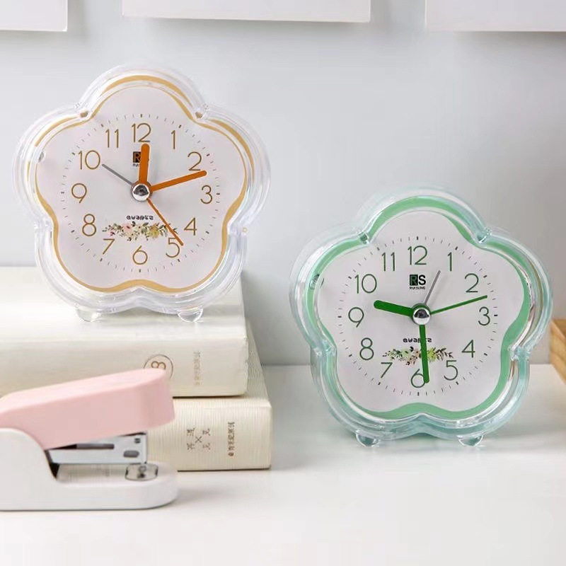 Ventas de fábrica simple reloj de alarma de plástico estudiante reloj de color caramelo con luz en forma de flor de dibujos animados fácil de llevar reloj de alarma