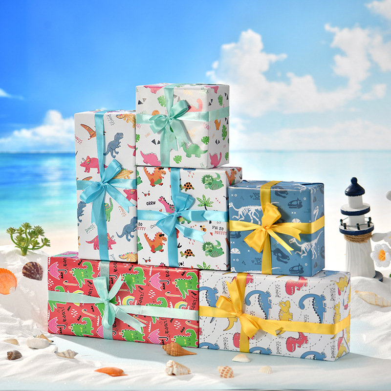 Nuevo papel de embalaje de regalos transfronterizos Día de los niños cartón de dibujos animados papel de caja de regalo de cumpleaños lindo papel de embalaje de regalos de dinosaurios animales