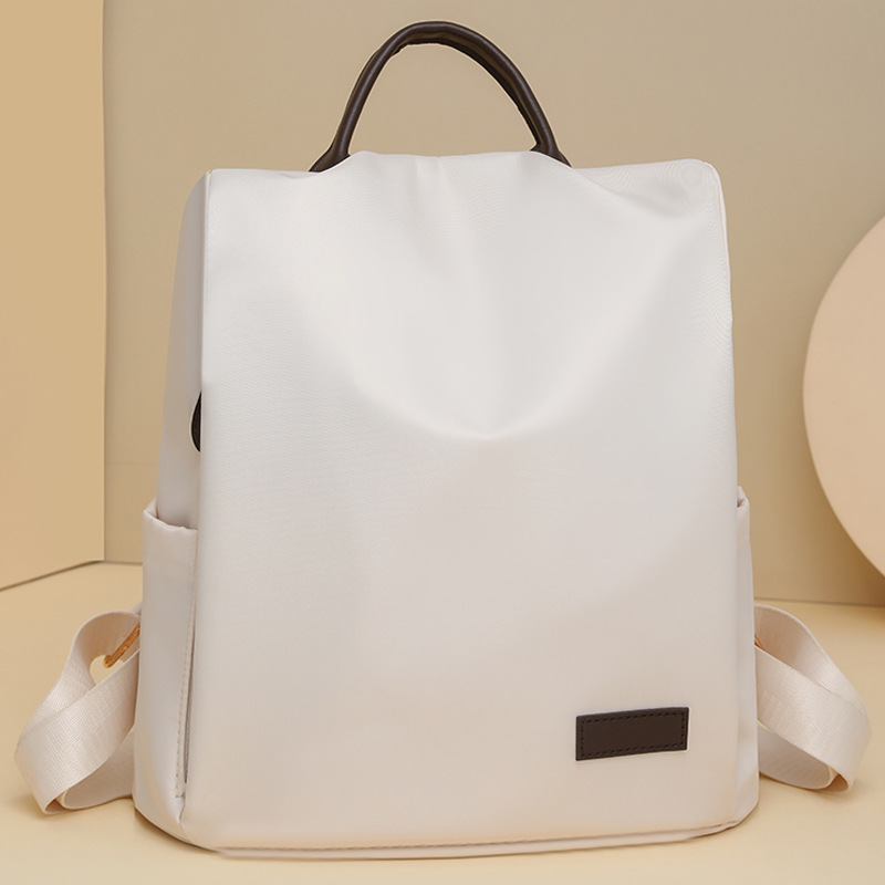 2024 verano nuevo estilo color sólido para mujer mochila de nailon simple ocio multifuncional antirrobo duradera mochila de viaje