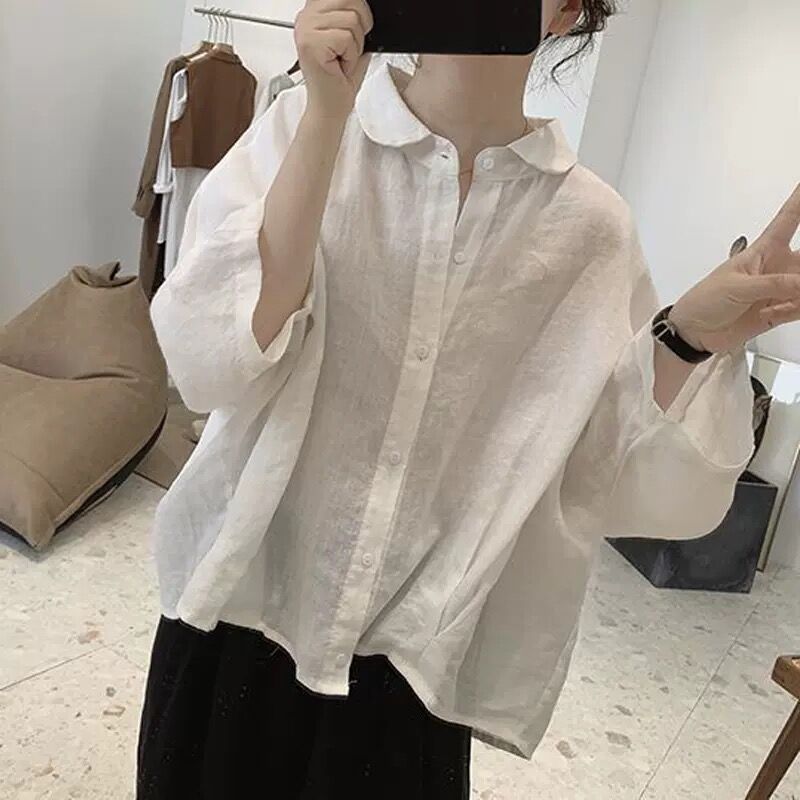 綿麻のシャツの女性の夏の新型のレトロなデザイン感がゆったりしています。