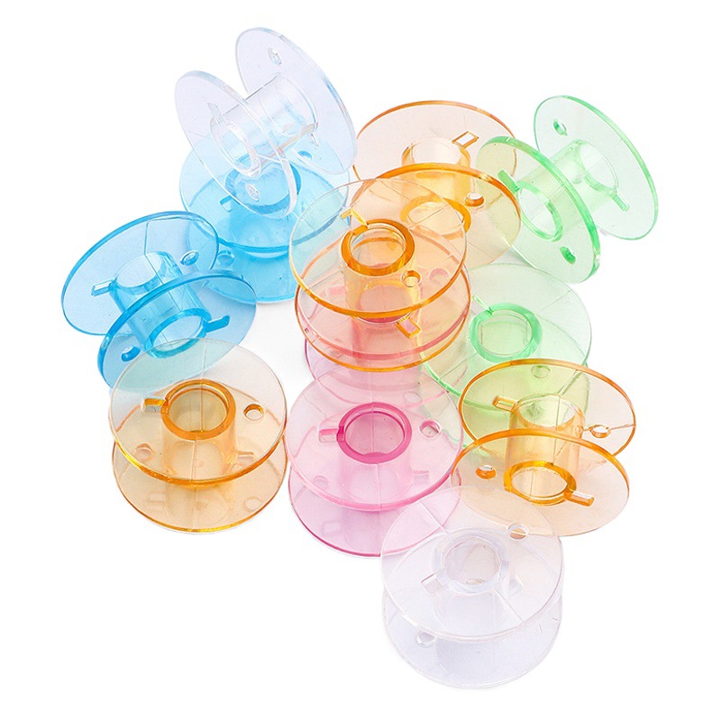 Fábrica al por mayor de color transparente de la bobina de plástico de color de caramelo carrete de hilo bobina hogar multifuncional máquina de coser bobina