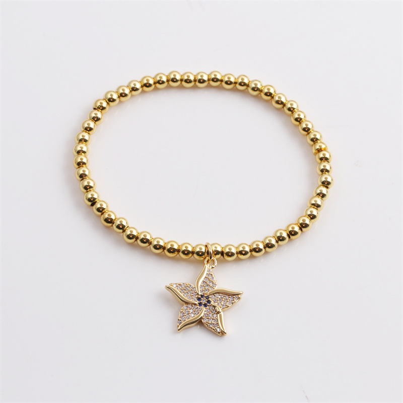 Copper Plated Real Gold Round Beads Zircon Starfish Bracelet Wholesale Nihaojewelry display picture 1