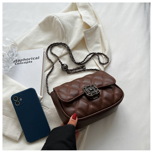 Solid-color Chanel-style embroidered thread diamond-quilted bag with a lock-and-key closure, featuring a fashionable, versatile chain strap and designed as a chic, easy-to-match shoulder bag for women.