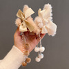 Plush hairgrip with bow with tassels, crab pin, shark, demi-season hair accessory, 2022 collection