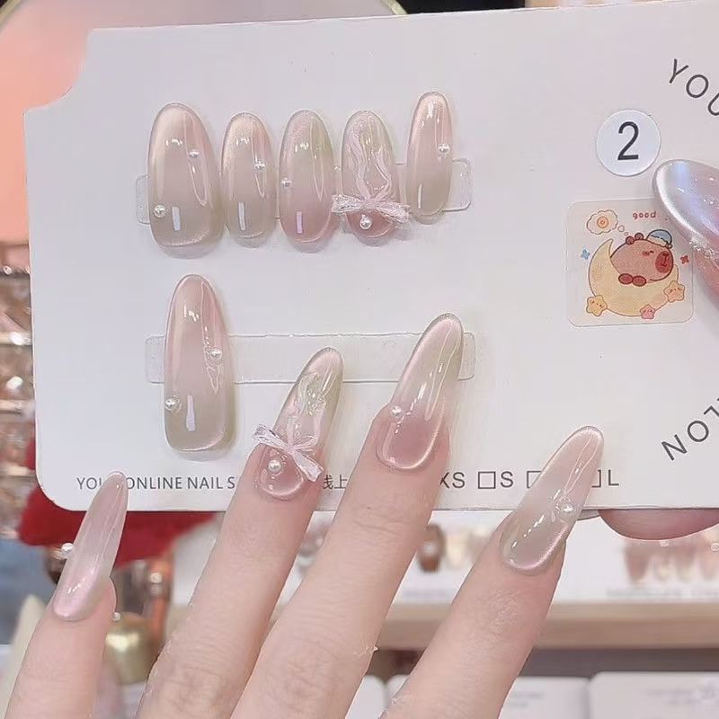 Melocotón Limina Pura hecha a mano con armadura intermitente ojo de gato degradado mariposa temperamento ligero lujo uñas de uñas removibles